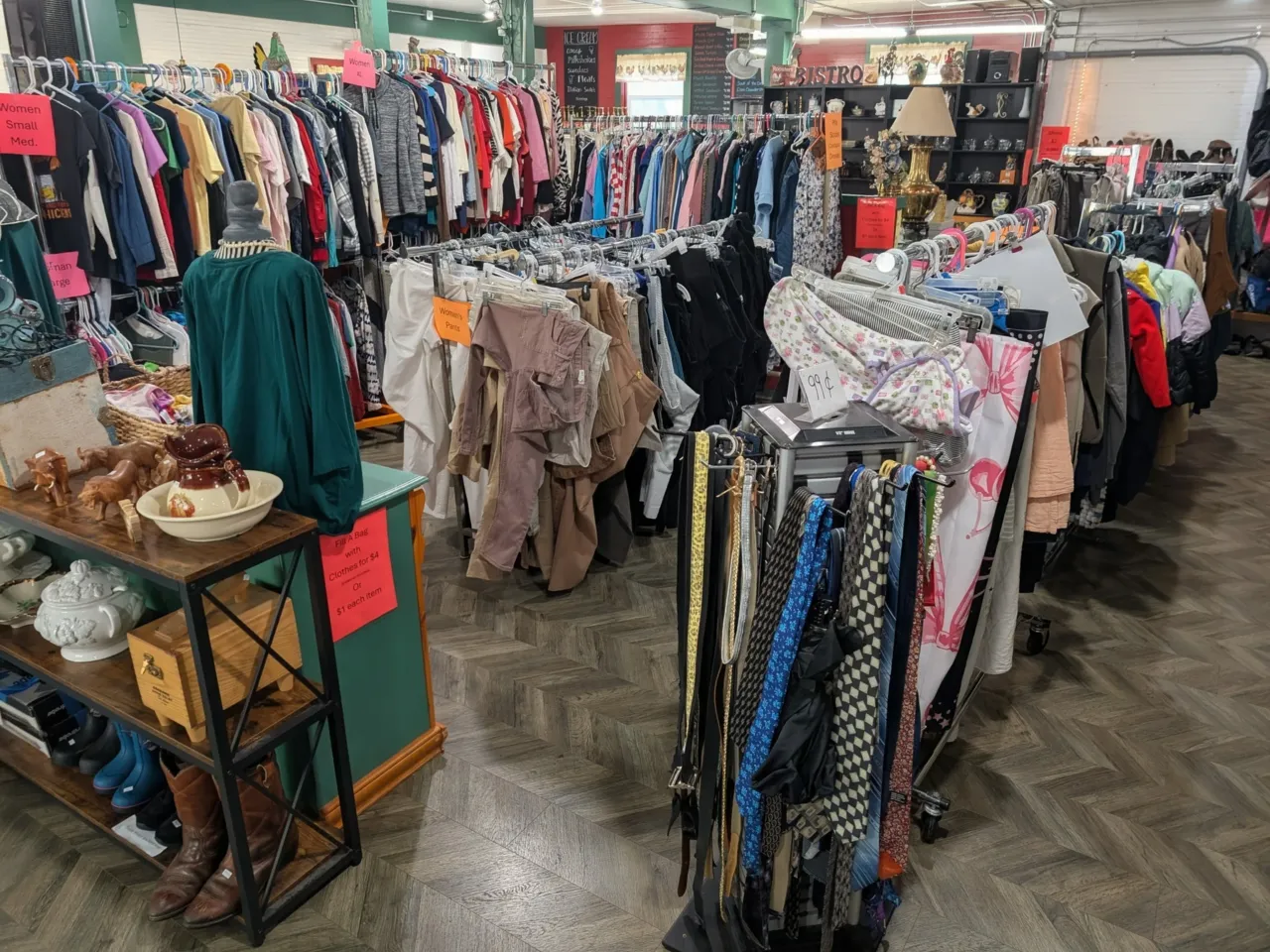Clothing racks inside the Rowdy Rooster Thrift Store
